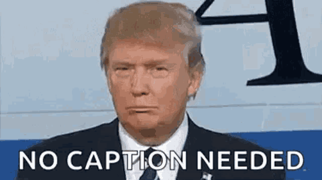 donald trump is making a funny face and says `` no caption needed '' while wearing a suit and tie .