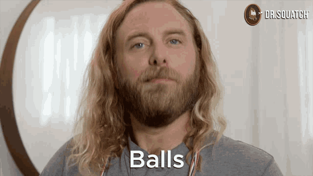 a man with long blonde hair and a beard says " balls "