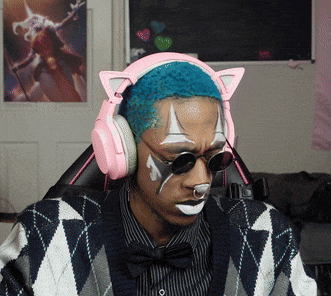 a man with cat ears on his headphones and face paint on his face