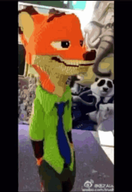 a cartoon fox wearing a green shirt and tie