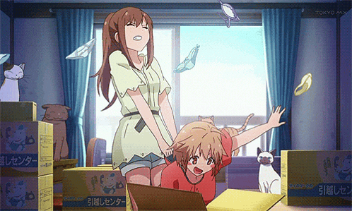 a tokyo mx anime shows a girl and a boy playing with boxes