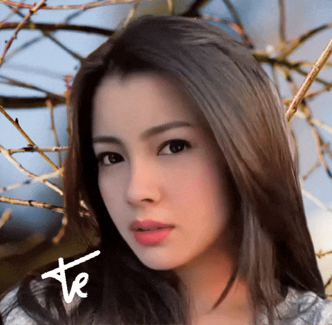 a close up of a woman 's face with the letters te on the bottom