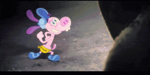 a pink and blue cartoon character with a yellow belt around his waist is smiling