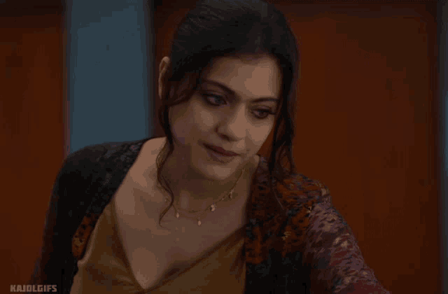 a close up of a woman 's face with the words kajol gifs below it