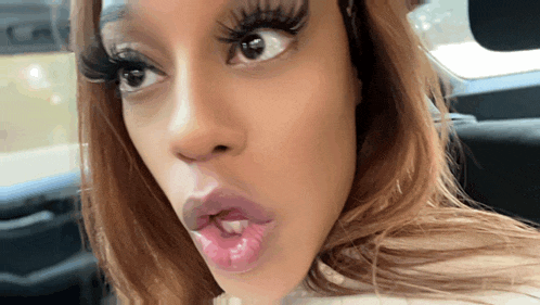 a close up of a woman making a funny face