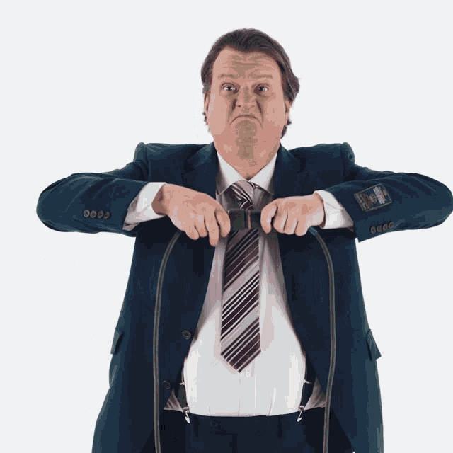 a man in a suit has a badge on his jacket that says ' a '