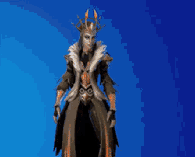 a woman in a costume with a crown on her head stands in front of a blue background .