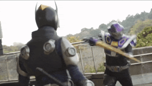 two superheros are fighting each other with swords and a sword .