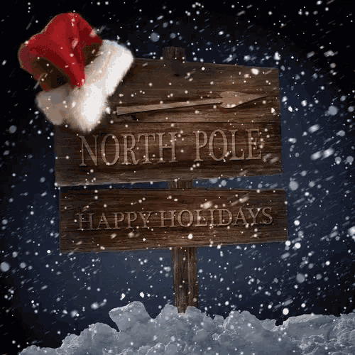 a santa hat sits on a wooden sign that says north pole happy holidays
