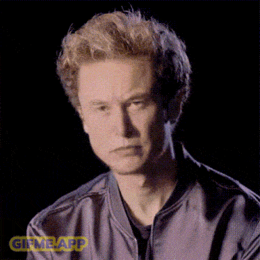 a close up of a man 's face with a gif me app sticker
