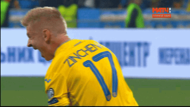 a man in a yellow shirt with the number 7 on the back