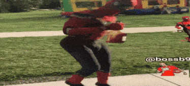 a person in a spiderman costume is dancing
