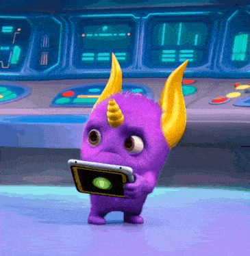 a purple monster with horns is holding a tablet