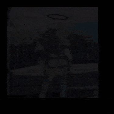 a person in a white costume with a halo on their head is standing on a sidewalk holding a gun .
