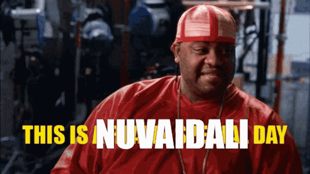 a man in a red shirt with the words this is nuvaidali day on the bottom
