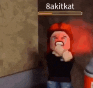 a girl with red hair is crying in front of a wall with a loading bar .