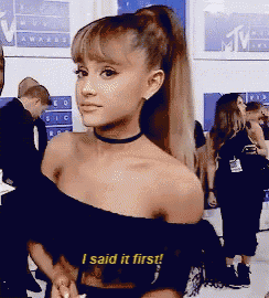 ariana grande is wearing a black off the shoulder top and choker and says " i said it first "