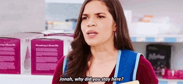 a woman is talking to another woman in a store and asking why did you stay here .
