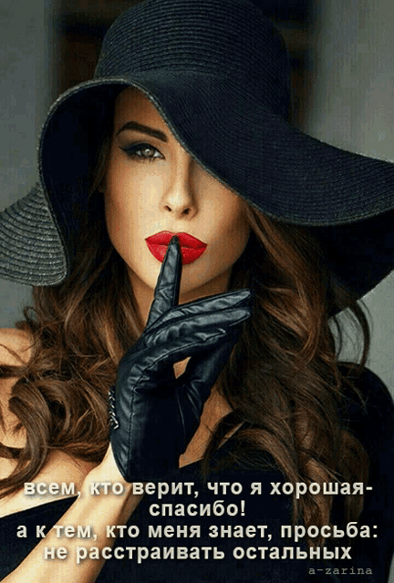 a woman wearing a hat and gloves has her finger to her lips