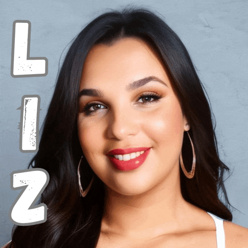 a woman with red lipstick and hoop earrings is smiling with the letters l and z behind her