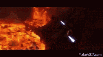 a gif of a person holding a lightsaber with the website makeagif.com visible