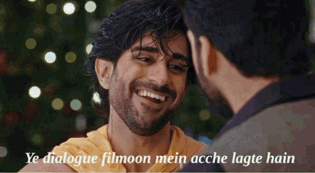 two men are looking at each other with the caption ye dialogue filmoon mein acche lagte hain