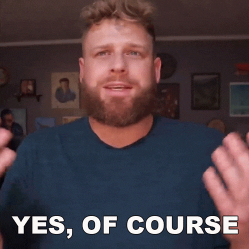a man with a beard and a blue shirt says yes of course