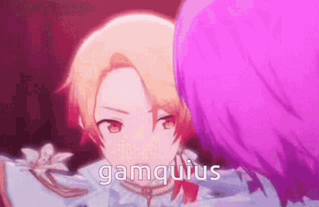 a close up of a person 's face with the word gamquius written on it .