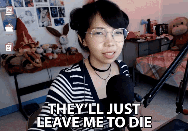 a woman wearing glasses and a choker says they 'll just leave me to die in front of a microphone
