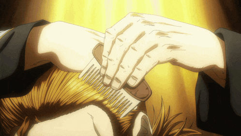 a close up of a person brushing their hair