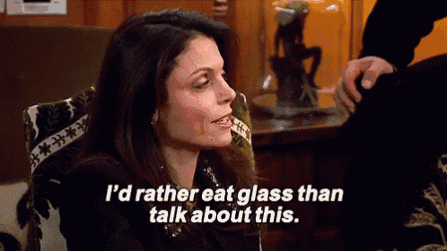 a woman is sitting in a chair and saying " i 'd rather eat glass than talk about this . "