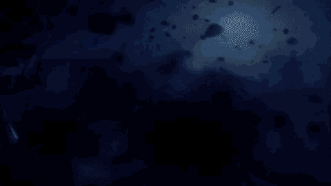 a dark blue background with a lot of bubbles