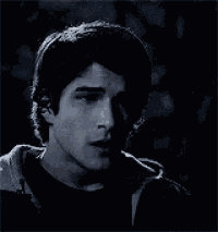 a close up of a man 's face in a dark room .