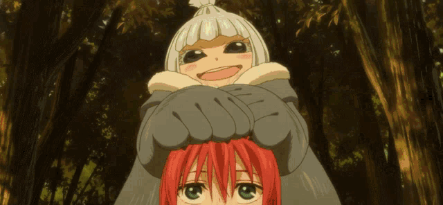 a girl with red hair is being held by a giant monster