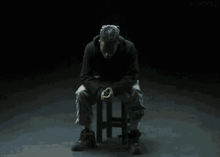 a man is sitting on a stool with the words " your demon seems to honor your efforts "
