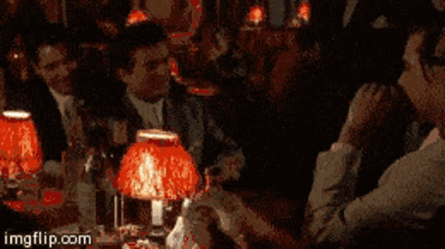 a group of men sitting at a table with the words funny how written on the bottom