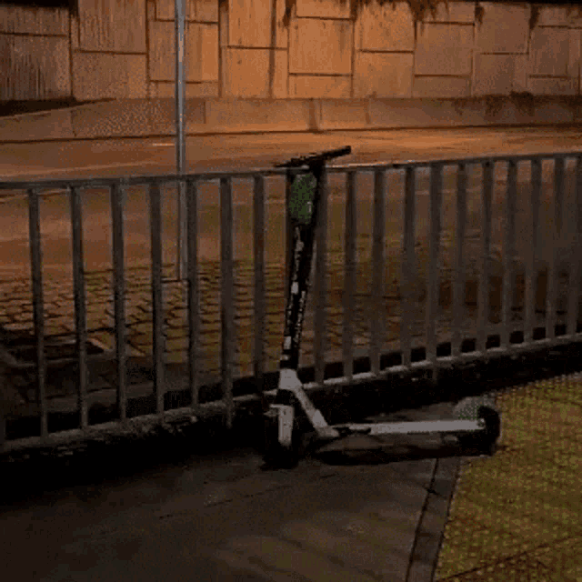 a yellow sign that says anarchy is behind a fence