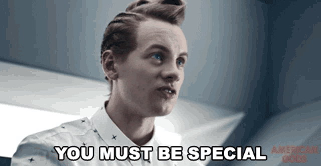 a man in a white shirt says " you must be special " in red letters