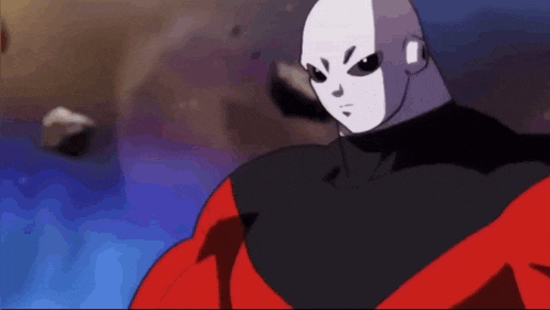 a man in a red and black costume is holding his fist up in a fist .