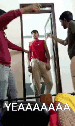 a man in a red shirt is standing in front of a mirror with a caption that says yeaaa aaa