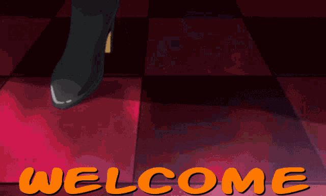 a man standing in front of a welcome sign