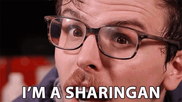 a man with glasses and a mustache is saying i 'm a sharingan