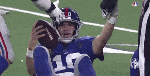 a football player with the number 17 on his jersey is holding a football