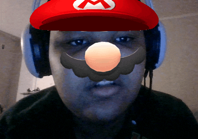 a man wearing a mario hat and headphones