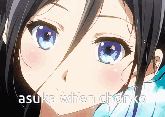 a close up of a girl 's face with the words " asuka when chonko " below her