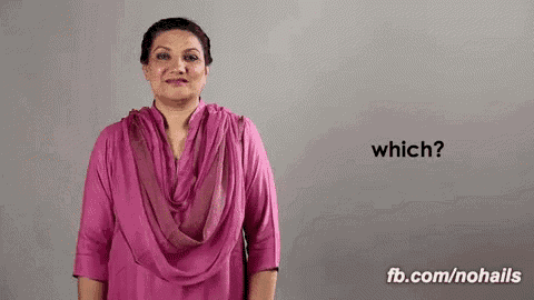 a woman in a pink shirt and scarf is asking which .