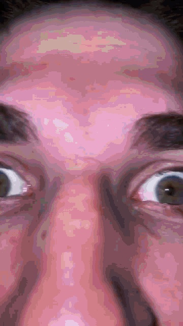 a close up of a person 's face with their eyes open