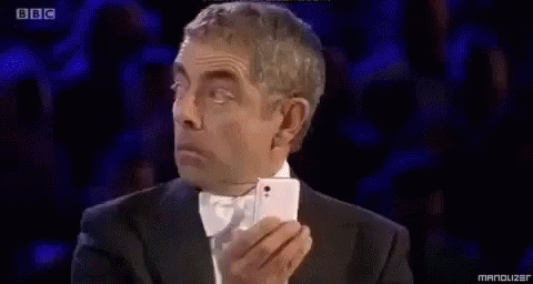 Rowan Atkinson Phone GIF - Rowan Atkinson Phone No Ones Looking GIFs