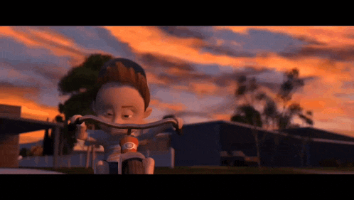 a cartoon boy is riding a tricycle in front of a sunset
