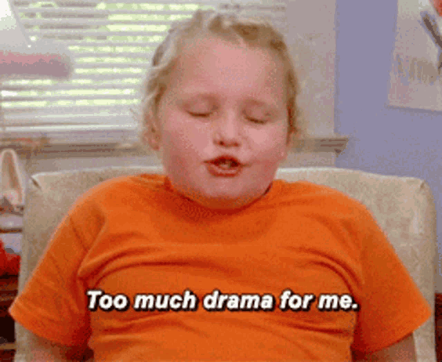 a little girl is sitting in a chair and says too much drama for me